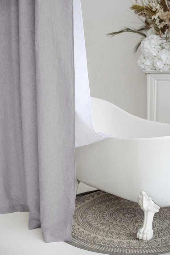 a white bath tub sitting next to a window